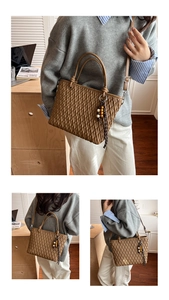 Lifestyle view of brown woven bucket bag with beaded tassel and adjustable strap