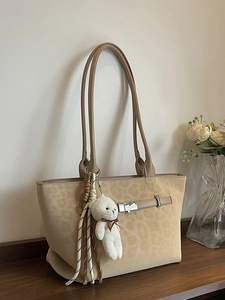 Leopard print faux suede tote bag with belt buckle detail and plush bear charm