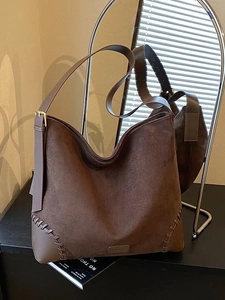 Retro large brown suede shoulder bag with woven stitching and adjustable strap for commute