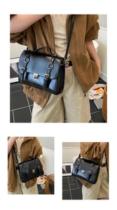 Dettaglio di una borsa a tracolla vintage nera con ecopelle lucida e fibbie metalliche