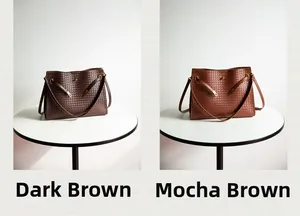 Detail view of woven tote bags in Dark Coffee and Mocha Brown with golden metal buckles