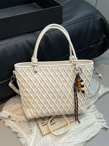 Elegant white woven texture bucket bag with top handles and a detachable shoulder strap