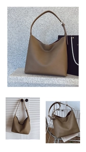 Close-up of khaki leather tote bag featuring a pebbled texture and silver metal buckle