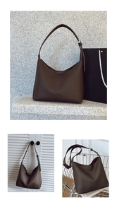 Detail of dark brown leather hobo bag with adjustable strap and minimalist logo