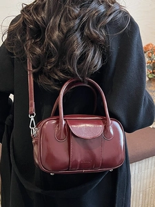 Retro burgundy oily leather bowling handbag for women with double handles and shoulder strap