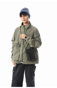 Olive green workwear jacket with multiple flap pockets and a mini crossbody phone bag
