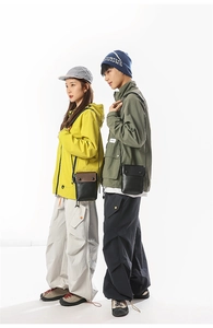 Outdoor lifestyle shot of mini canvas crossbody phone bags in solid and contrast colors