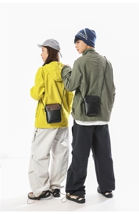 Rear view of minimalist leather mini crossbody phone bags on male and female models