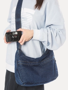 Classic dark blue denim crossbody bag with vintage orange stitching for casual daily wear