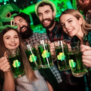 St. Patrick's Day glass beer mugs with Lucky clover design for festive party celebrations