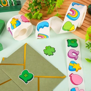 Roll of cartoon St. Patrick's Day stickers featuring rainbow and clover patterns