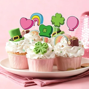 Saint Patrick's Day heart and shamrock cupcake toppers on pink muffins for party decoration