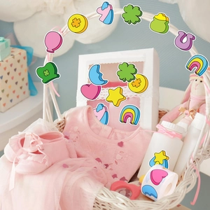 Close-up of colorful cartoon heart and rainbow reward stickers on a white gift basket