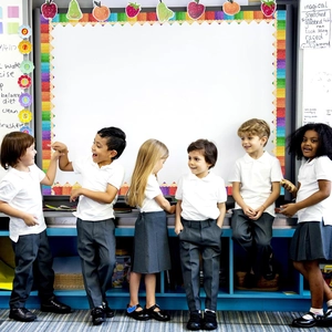 Classic school uniform set including white polo shirts, dark grey pants, and pleated skirts