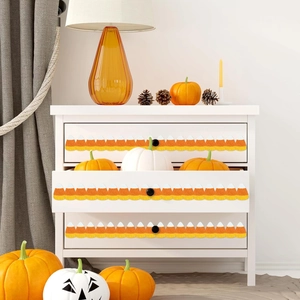 Glitter candy corn bulletin board border strip applied on white drawer for Halloween