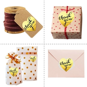 Golden heart-shaped Thank You stickers on gift boxes, tags, envelopes and clear bags