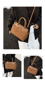 Detail view of brown suede handbag featuring metallic buckles and adjustable strap
