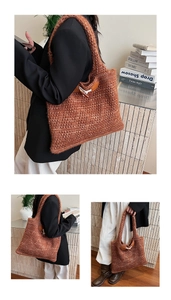 Detailed close-up of brown cable knit tote bag showing texture and leather buckle strap