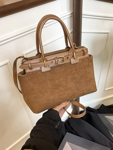 Brown faux suede handbag with smooth leather trim and adjustable shoulder strap for women