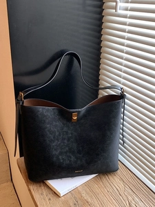 Minimalist black vintage suede tote bag with leopard lining and golden metal buckle details