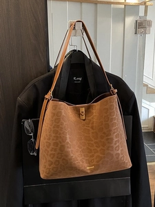 Brown leopard print suede tote bag with gold turn-lock and adjustable shoulder strap