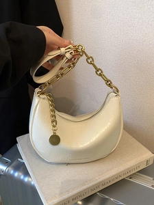 Chic beige pleated half-moon shoulder bag with decorative gold chain handle