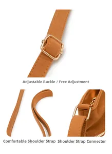 Détail d'une bandoulière en daim réglable avec boucle en métal doré sur sac marron