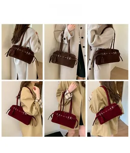 Detail showing vintage suede shoulder bags with retro metal buckle straps in deep brown and wine