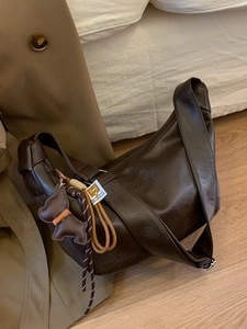 Retro large brown hobo bag with pleated texture and adjustable strap plus bear charm