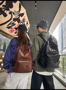 Close-up of stylish PU leather backpack showing reinforced straps and side mesh pockets