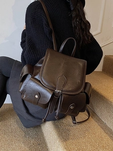 Retro dark brown pleated leather backpack with multiple pockets for daily commuting