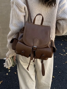 Retro dark brown PU leather pleated backpack with drawstring closure and metal buckles