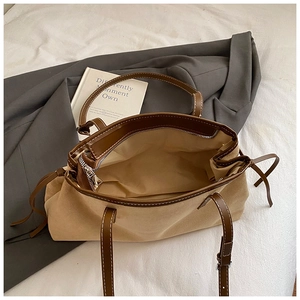 Retro beige suede tote bag with brown leather trim and metal zipper for daily commute