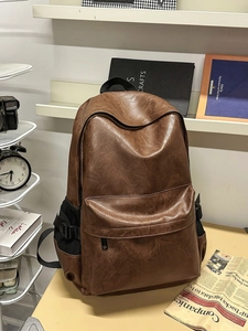 Retro large capacity PU leather backpack in dark brown with multiple compartments for students
