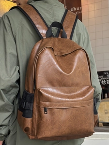 Waterproof PU leather backpack in vintage brown featuring large capacity and stylish design