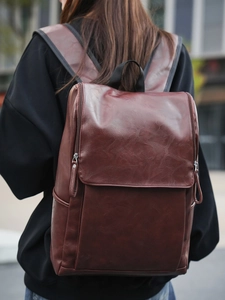 Minimalist red brown PU leather backpack for men and women featuring vintage textured finish