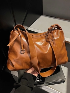 Vintage large brown oil wax leather tote bag with silver ring detail for daily commute