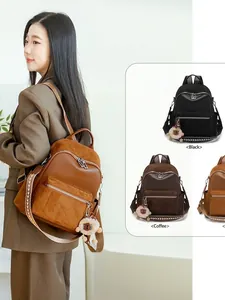 Chic quilted leather backpack with woven strap and plush charm in various colors