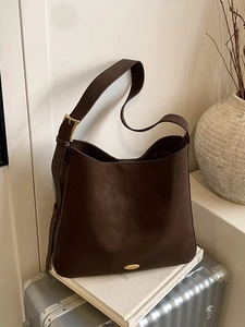 Minimalist vintage dark brown matte leather tote bag with gold metal buckle detail
