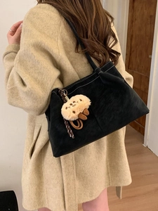 Black corduroy tote bag with white contrast stitching and cute mushroom charm accessory