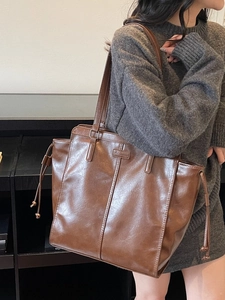 Retro brown large capacity tote bag in glossy leather with side drawstring detail