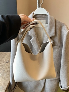 Large beige pebbled leather hobo tote bag for women with wide shoulder strap