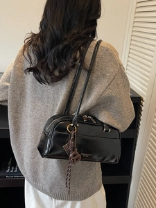 Glossy black patent leather Boston shoulder bag with silver hardware and logo detail