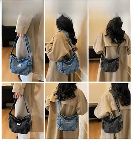 Detail view of denim hobo bag featuring side pockets and adjustable shoulder strap