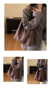Detailed view of woven leather hobo bag in dark brown with minimalist shoulder strap style