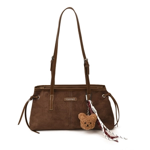 Vintage brown suede tote bag with teddy bear pendant and woven tassel detail