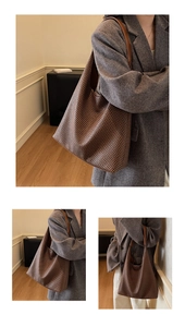 Detailed macro view showing woven texture of a large brown faux leather tote shoulder bag