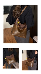 Detail of vintage tote bag with contrast suede splicing and decorative pom-pom pendant