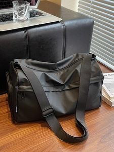 Waterproof black multi-layer crossbody bag with wide adjustable strap for commuting
