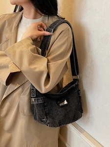 Vintage black oversized tote bag for women in durable denim material with shoulder strap